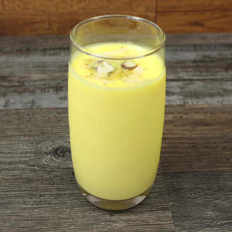 Mango Lassi topped with pistachio and almond